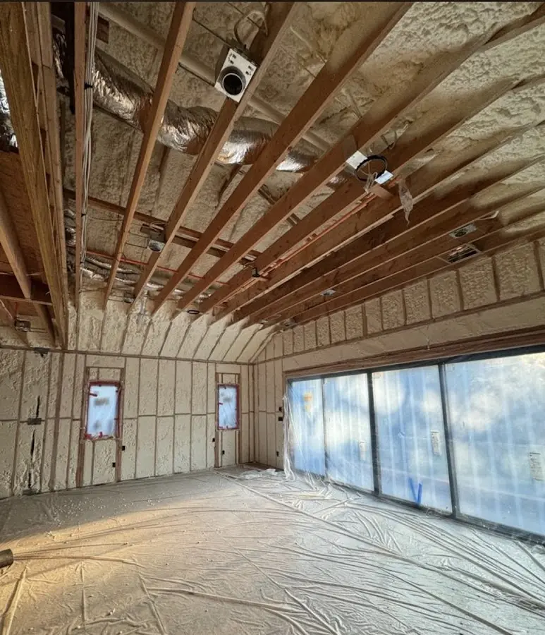 Interior walls and ceiling insulated with spray foam during new construction in Sheboygan